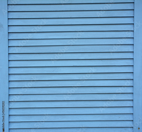 Blue shutter shades wooden background. Wooden planks painted with blue paint textured background.