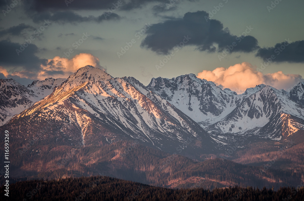 Fototapeta premium Cloudy Tatra mountains in the morning, covered with snow