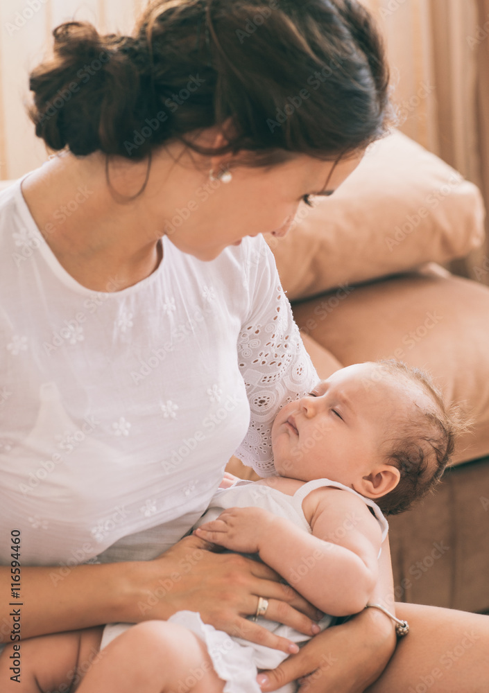 Portrait of happy mother and baby together at home. Portrait of happy mother and baby together at home.