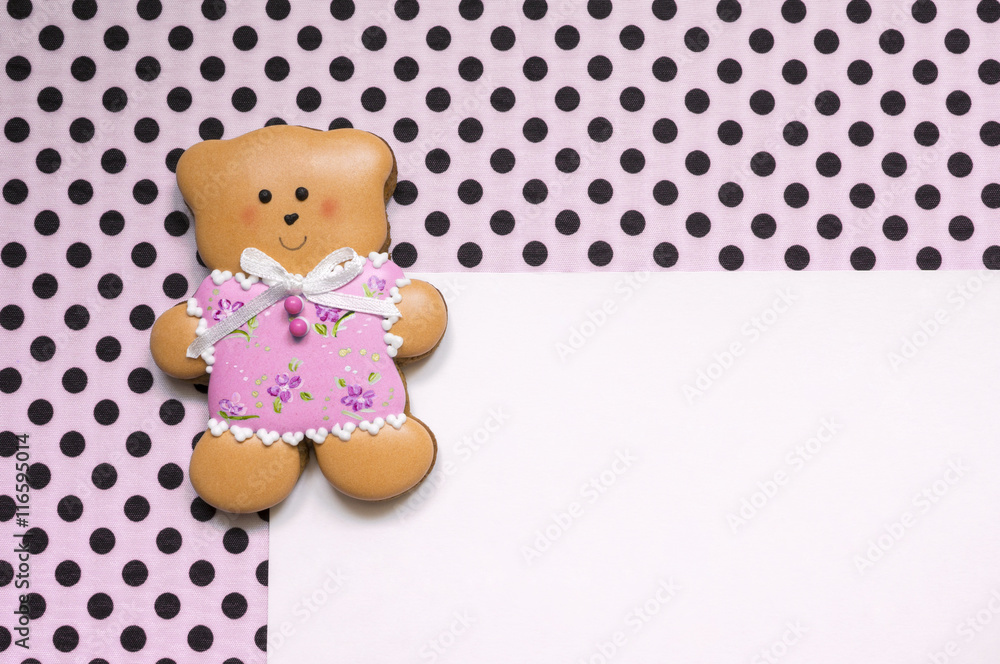 Polka-dot background with a honey-cake bear Polka-dot background with a honey-cake bear