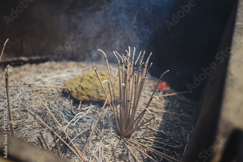 smoking incense sticks in Lama temple, Beijing, China
