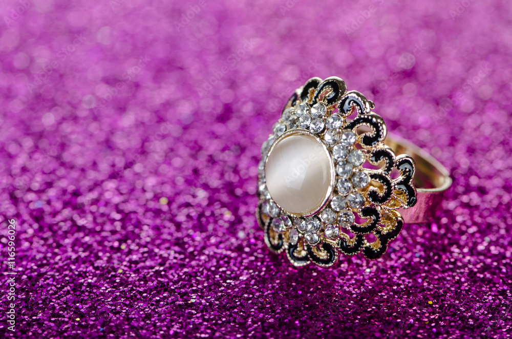 Jewellery ring against shiny background Jewellery ring against shiny background