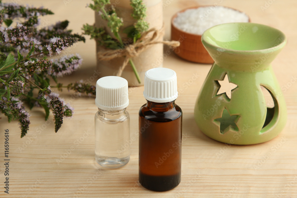 Essential oil on a wooden background. The concept of aromatherapy. Essential oil on a wooden background. The concept of aromatherapy.
