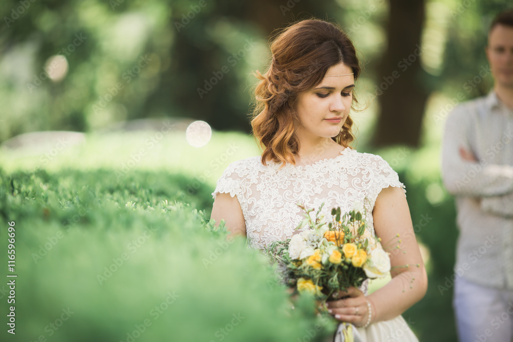 Beautiful, perfect couple posing on their wedding day Beautiful, perfect couple posing on their wedding day