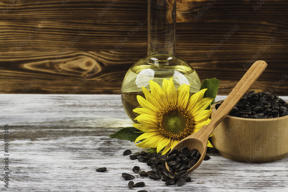 Sunflowers, bottle with oil and sunflowers seed