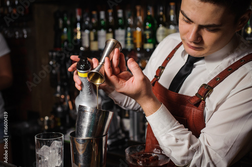 Barman is making a cocktail