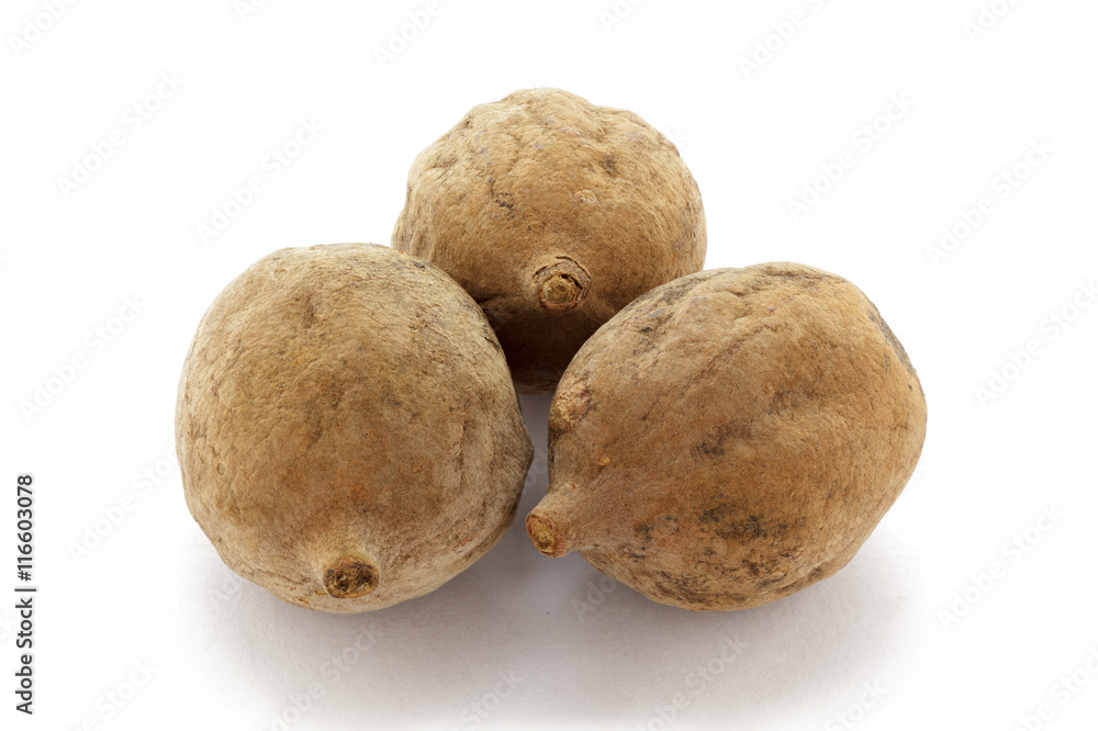 Organic dry Bahera or Beleric (Terminalia bellirica) seeds. Isolated on white background. Macro close up. Top view. Organic dry Bahera or Beleric (Terminalia bellirica) seeds. Isolated on white background. Macro close up. Top view.