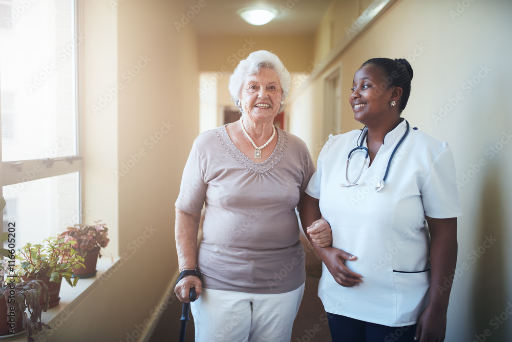 Obraz premium Happy doctor and patient together at nursing home