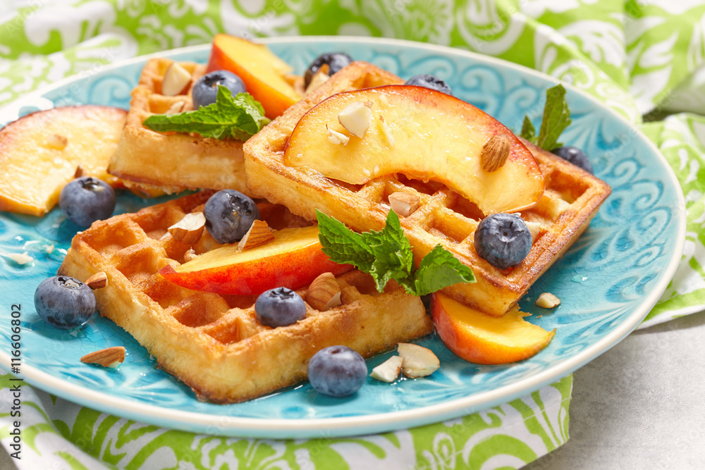 Plate of belgian waffles with fresh berries Plate of belgian waffles with fresh berries