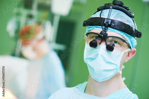 male cardiac surgeon with cardiosurgery equipment photo