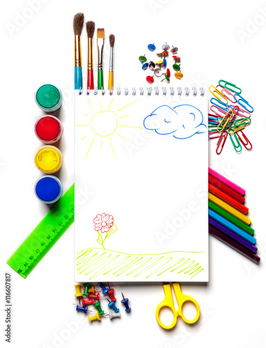 School and art supplies laid out on a white background isolated.