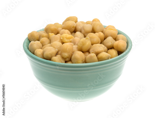 Bowl filled with organic garbanzo beans on a white background.