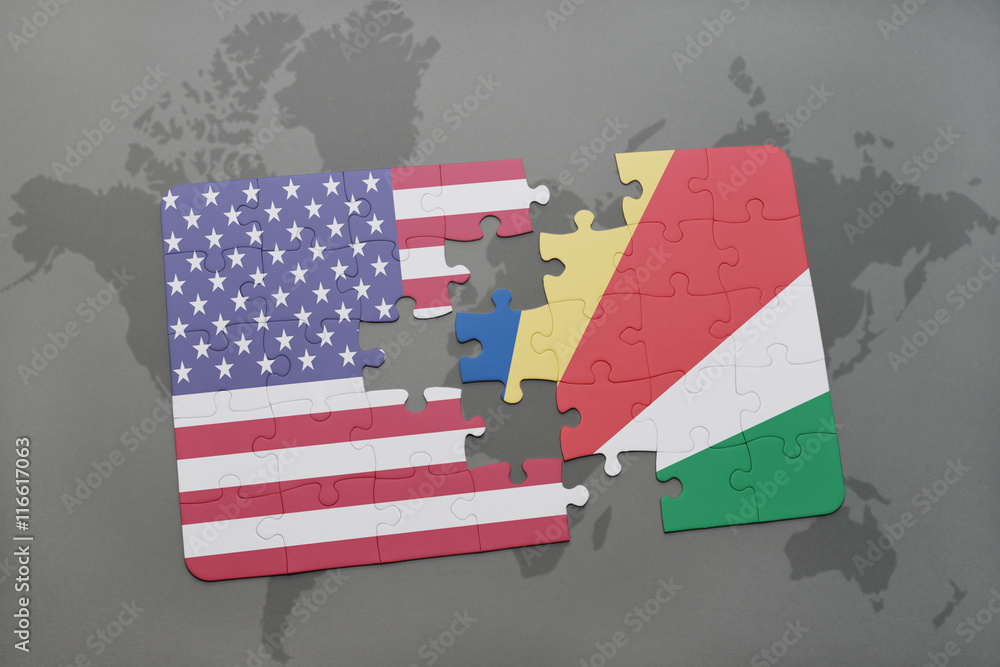 Obraz premium puzzle with the national flag of united states of america and seychelles on a world map background.