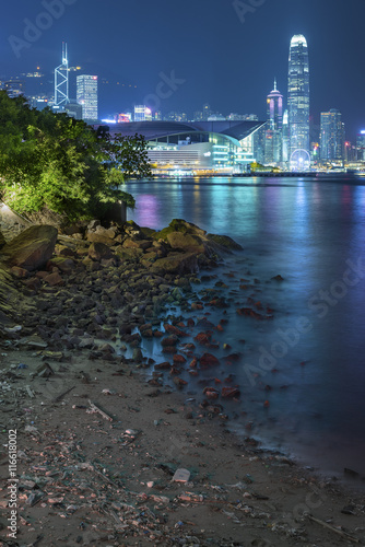Skyline and harbor of Hong Kong city at night