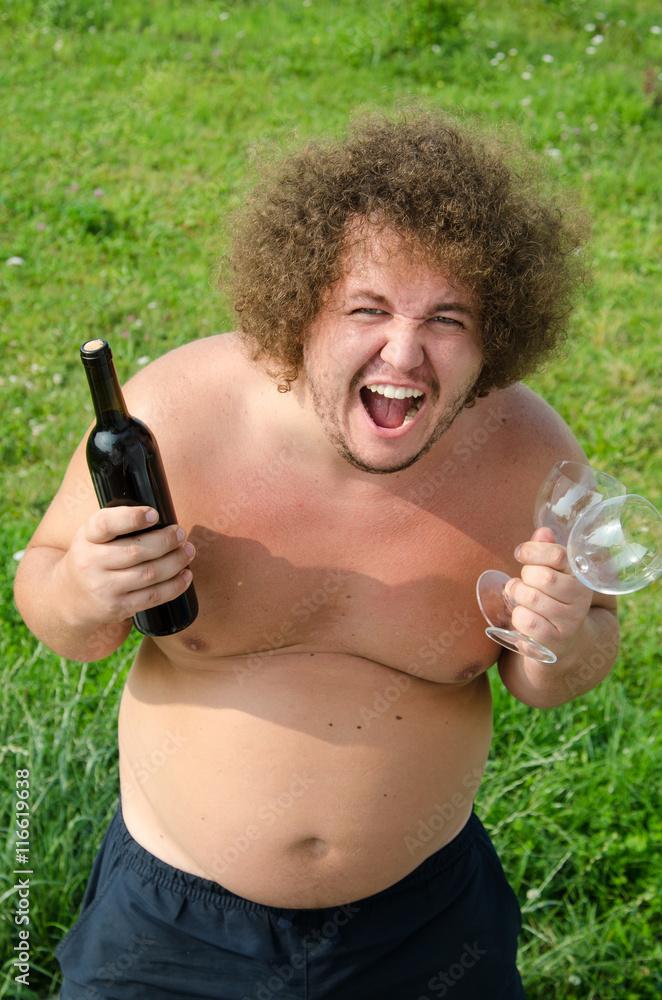 Funny fat guy with a bottle of wine Stock Photo | Adobe Stock