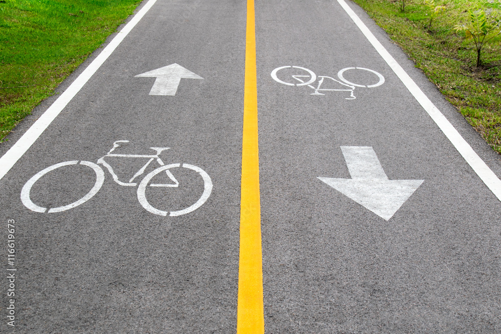 Bicycle sign and arrow sign on the road Bicycle sign and arrow sign on the road