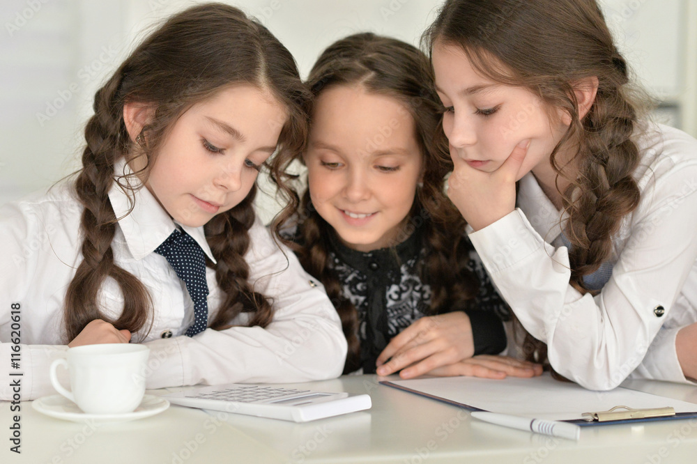 Three little girls making homework Three little girls making homework