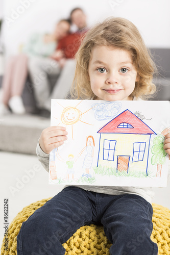Fotografie Happy family live and on drawing