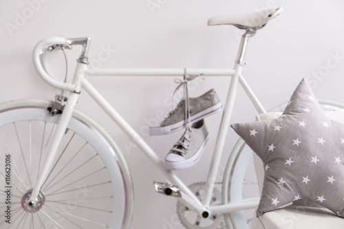 White bicycle and sneakers