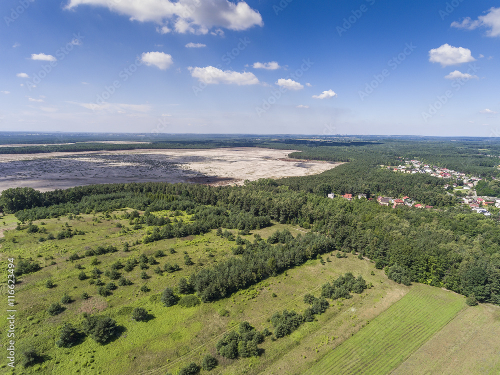 Rural landscape with green hill and blue sky in Poland. View fro