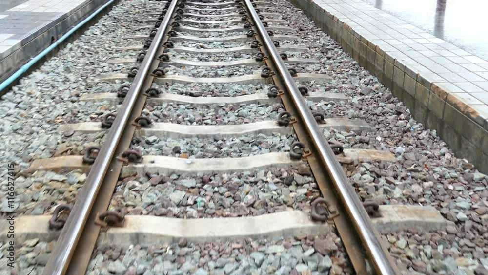 walking on railway in train station
walking on railway in train station