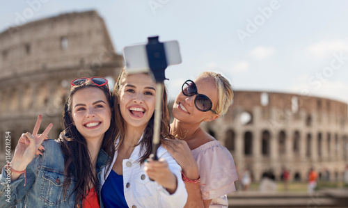 Photography group of smiling women taking selfie in rome