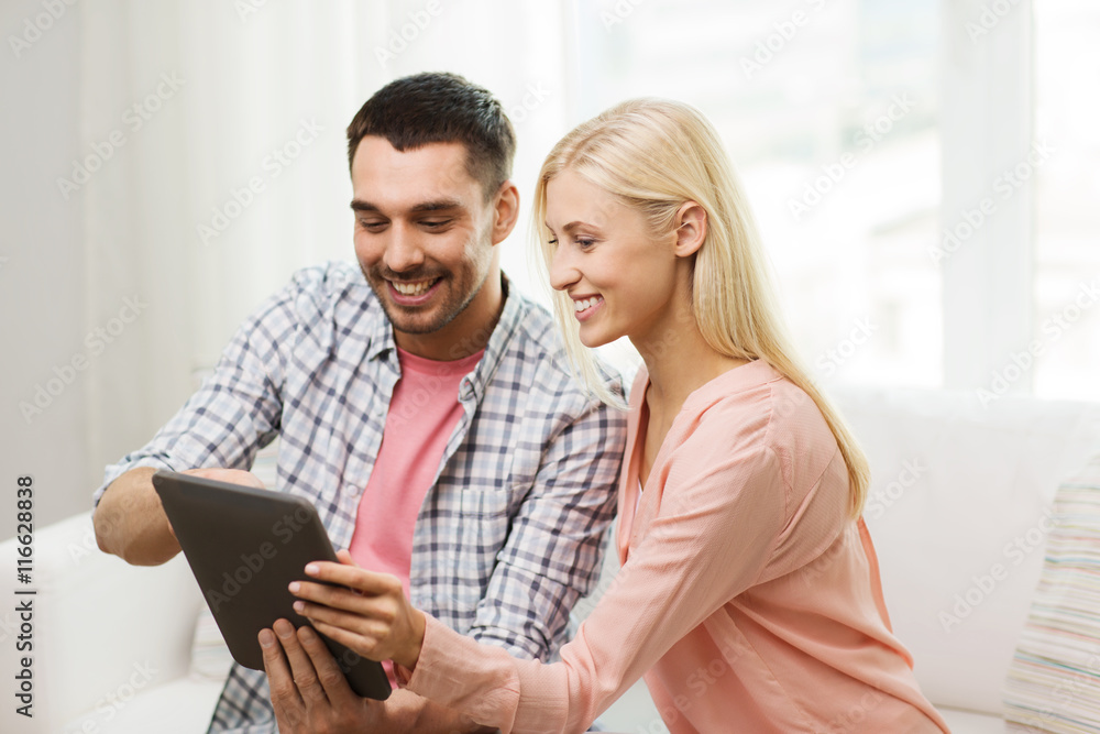 smiling happy couple with tablet pc at home smiling happy couple with tablet pc at home