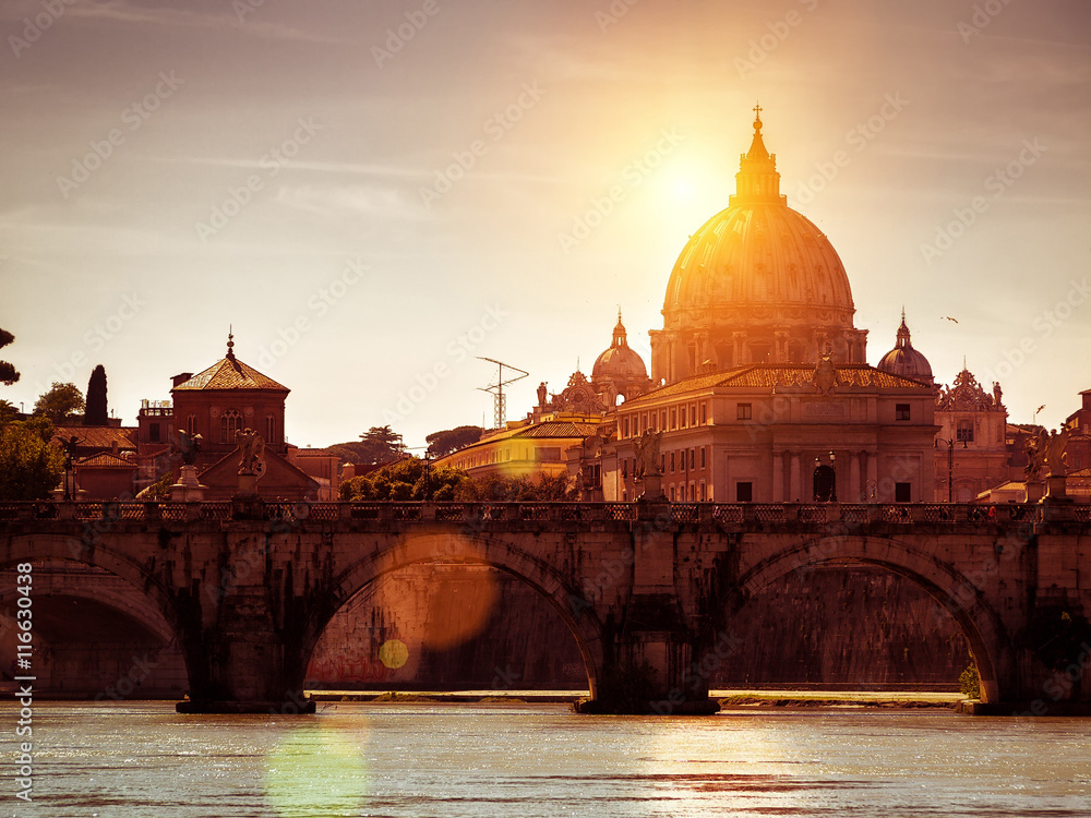Basilica San Pietro (Saint Peter's cathedral) at sunset in Rome,