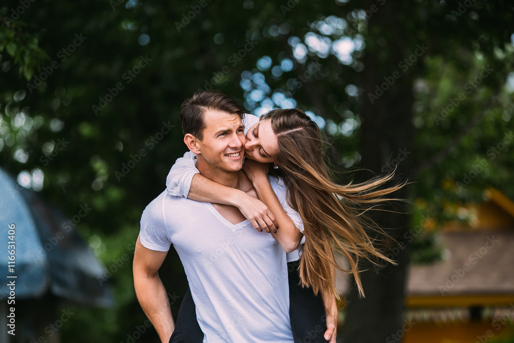 Young adult brunette man and woman in the park Young adult brunette man and woman in the park