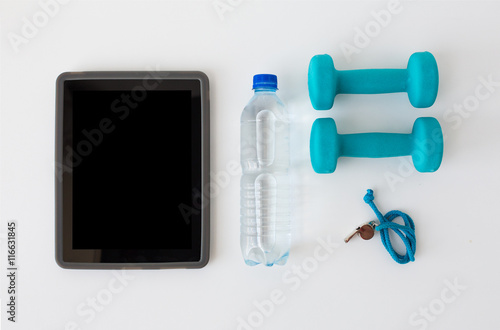 tablet pc, dumbbells, whistle and water bottle