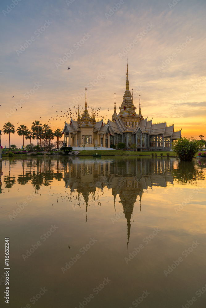 A beautiful sunset at temple in reflection in twilight  , Nakorn