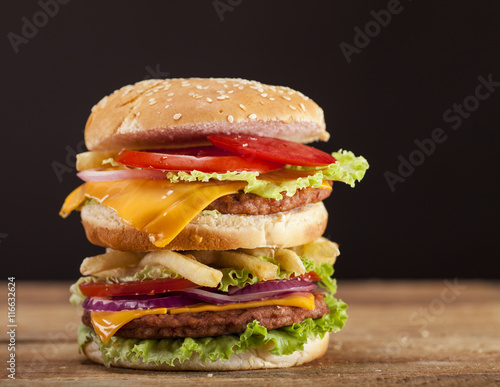 Fresh burger on wooden background