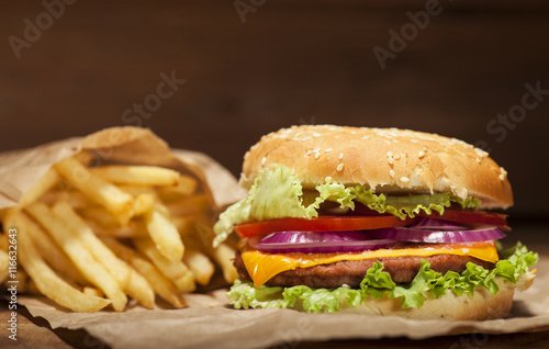 Fresh burger on wooden background
