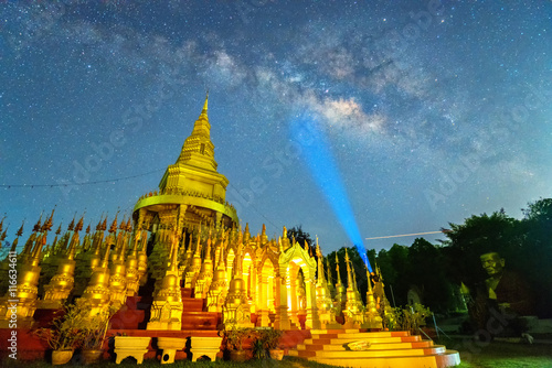 Beautiful golden pagoda of Pa sawangboon temple with milky way a