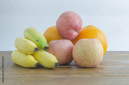 mixed fruits on wooden table