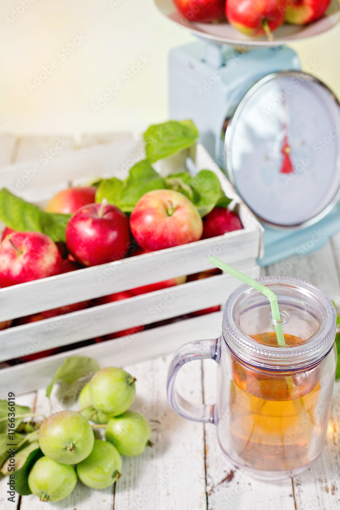 fresh juice and red apples in wooden box fresh juice and red apples in wooden box
