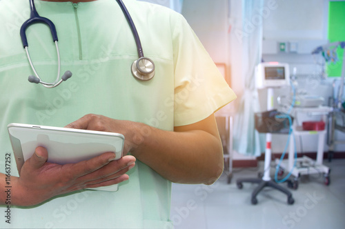 nurse working with tablet in hospital