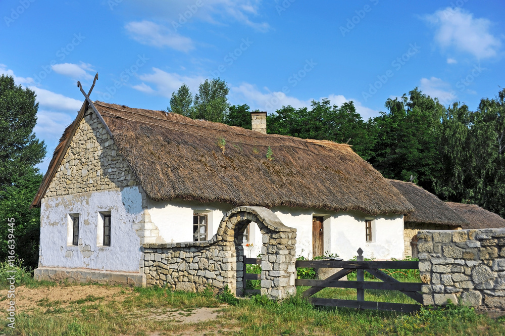 Ancient hut with a straw roof Ancient hut with a straw roof