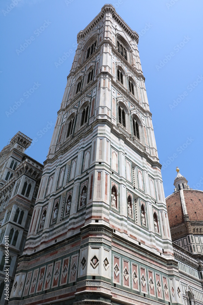 Upwards view to Campanile di Giotto and parts of Florence Cathedral, Tuscany Italy