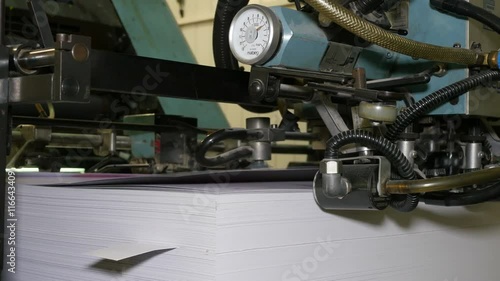 Printing house, vintage printing machine, vacuum sheet fed process, related to press. Closeup. 4K Ultra HD.