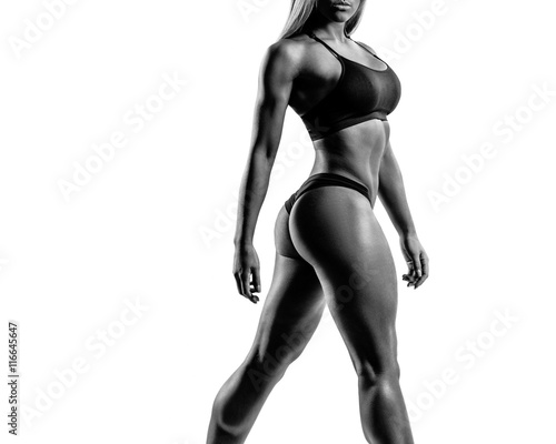 beautiful fitness woman posing on studio background