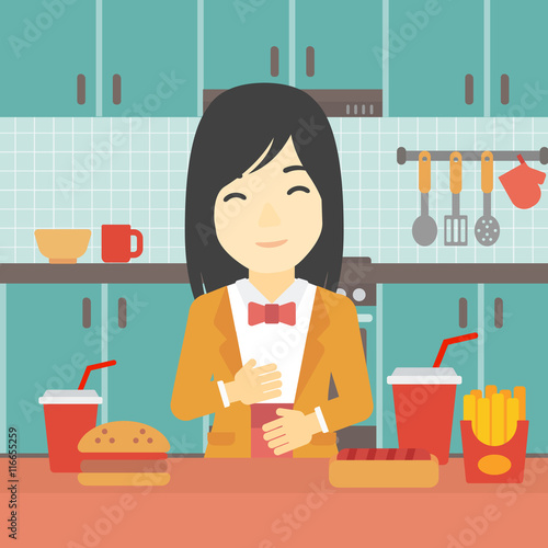 Satisfied woman eating fast food.