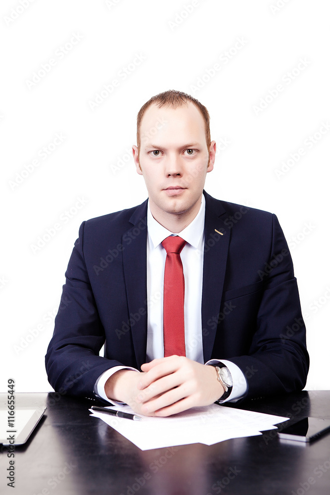 Real estate agent at the table with the tablet before signing th Real estate agent at the table with the tablet before signing th