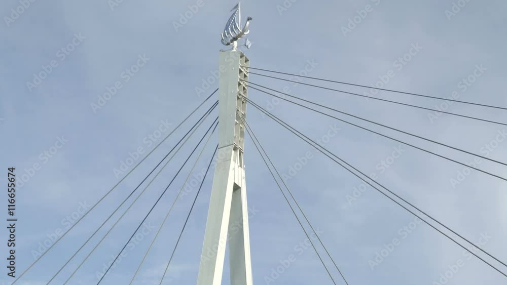 The brigde in Tartu with boat logo on the tip that has the directions sign on it The brigde in Tartu with boat logo on the tip that has the directions sign on it