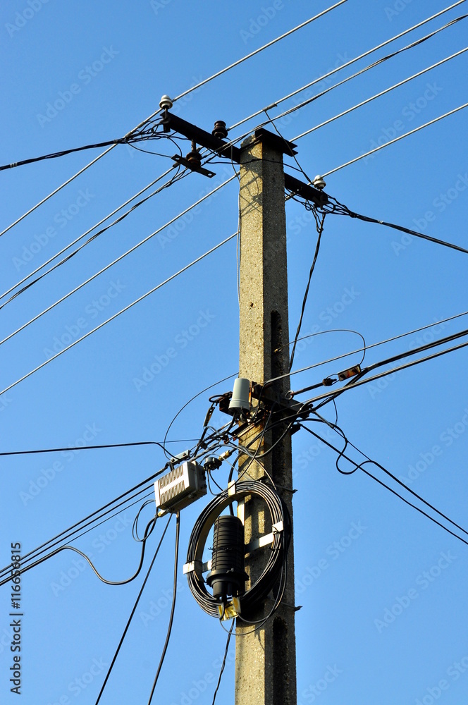 LED street lighting and power lines with blue sky background LED street lighting and power lines with blue sky background