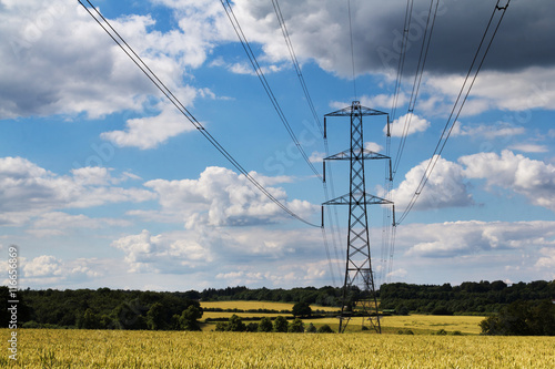 Electricity pylons going across the English countryside