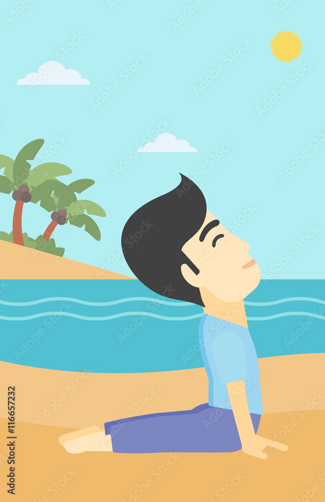 Man practicing yoga upward dog pose on the beach.