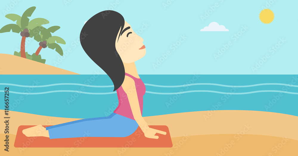 Woman practicing yoga upward dog pose on beach.