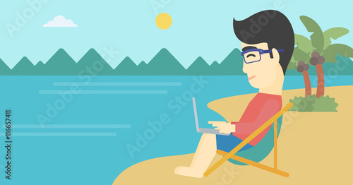 Businessman working on laptop on the beach.