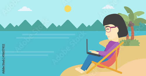 Business woman working on laptop on the beach.